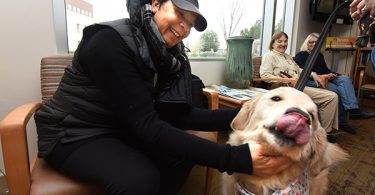 Gracie brings joy and love to visitors at the Georgia Cancer Center.