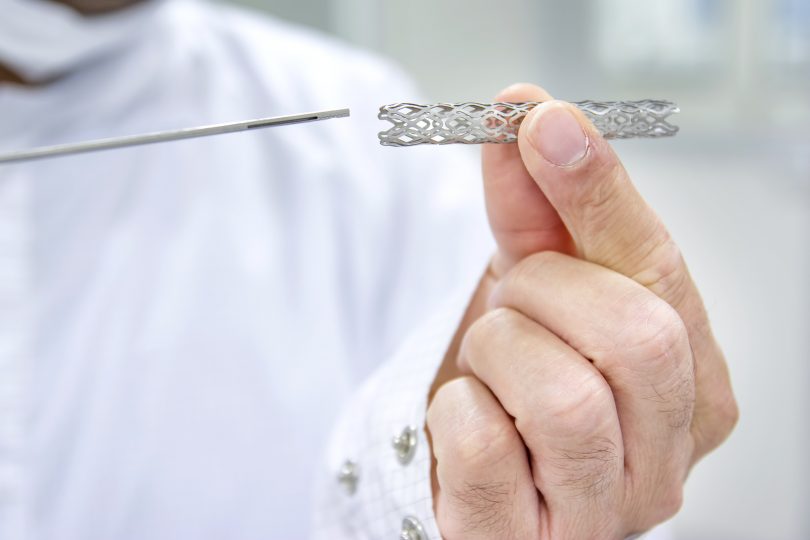 Doctor holding cardiac catheterization and heart stent