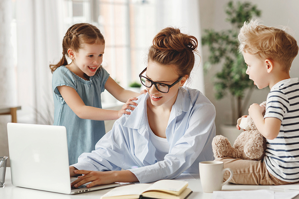 Mother working from home with kids