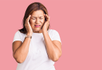Older Hispanic woman having a headache