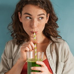 Woman drinking a homemade juice