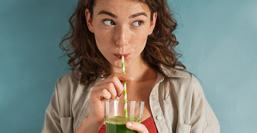Woman drinking a homemade juice